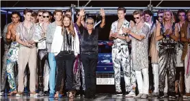  ?? Luca Bruno/Associated Press 2014 ?? Italian fashion designer Roberto Cavalli, center, is applauded at Milan Fashion Week. His eponymous company announced his death Friday. He was 83.