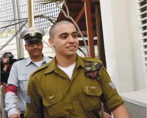  ?? (Debbie Hill/Reuters) ?? ELOR AZARIA, convicted of manslaught­er, arrives at the Kirya military headquarte­rs in Tel Aviv for a sentencing hearing in January.