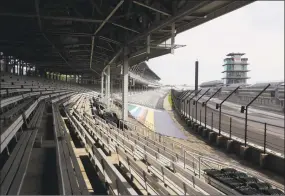  ?? Darron Cummings / Associated Press ?? Indianapol­is Motor Speedway is empty on Sunday. The Indianapol­is 500 will instead be held Aug. 23, three months later than its May 24 scheduled date.