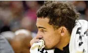  ?? JASON MILLER / GETTY IMAGES ?? With the Hawks in Chicago, Trae Young remained in Atlanta for treatment after spraining his right ankle during Friday’s loss to the Bucks.