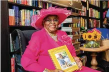  ?? NORA WILLIAMS/THE NEW YORK TIMES ?? Emily Meggett with her new cookbook, “Gullah Geechee Home Cooking,” at Buxton Books in Charleston, S.C. In the cookbook, Meggett, the keeper of centuries-old culinary traditions in the
South Carolina Lowcountry, shares her kitchen wisdom from a life of feeding others.