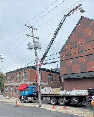  ?? COURTESY FITCHBURG ART MUSEUM ?? Crews have been hard at work replacing the roofs on two of the Fitchburg Art Museum buildings for the past several weeks. The project is expected to be finished by week’s end.