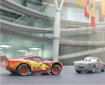  ?? DISNEY PIXAR ?? Owen Wilson-voiced Lightning McQueen, left, meets the smooth business car Sterling, voiced by Edmonton’s Nathan Fillion in the new movie Cars 3.