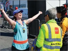  ?? Photo by Fergus Dennehy. ?? Mary O’ Sullivan cannot contain her delight in Fenit on Saturday after crossing the finish line of the Tri Kingom Come.