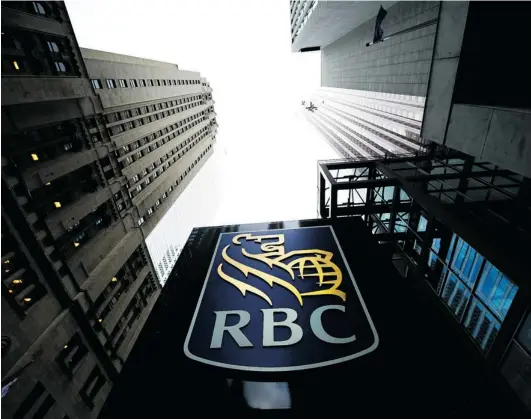  ?? NATHAN DENETTE/ THE CANADIAN PRESS ?? The Royal Bank of Canada is the focus of debate after deciding to outsource numerous Canadian jobs overseas. The Temporary Foreign Worker Program and other government labour laws have become high- profile political issues as public outcry grows over...