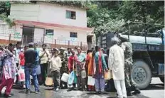  ?? AFP ?? Residents gather to collect drinking water in buckets from an ■ Army water tanker as the city faces water shortage in Shimla.