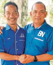  ??  ?? CALON BN DUN Manir, Yusof (kanan) bersama calon BN DUN Batu Buruk, Zamri.