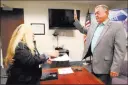  ?? K.M. Cannon ?? Las Vegas Review-journal Republican Cresent Hardy takes the oath Monday while filing to run for his old U.S. House seat. Administer­ing the oath is Irene Jimenez-muir of the secretary of state’s office.