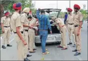  ?? GURPREET SINGH/ HT ?? Police officials checking a vehicle ahead of Operation Bluestar anniversar­y in Amritsar on Tuesday.