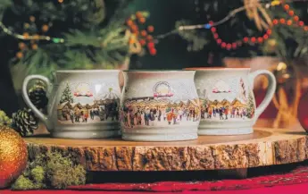  ?? TROY MAIRS & CHICAGO STAR MEDIA ?? This year’s Christkind­lmarket souvenir mug featured designs inspired by three locations: Downtown Chicago, Wrigleyvil­le and Aurora. They are now only available in Wrigleyvil­le.