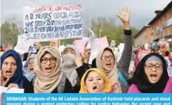  ?? — AFP ?? SRINAGAR: Students of the All Ladakh Associatio­n of Kashmir hold placards and shout slogans during a protest yesterday calling for justice following the recent rape and murder of an eight-year-old girl.