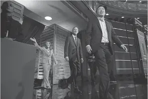  ??  ?? Democratic presidenti­al primary candidates, from left, Marianne Williamson, John Hickenloop­er and Andrew Yang enter the debate stage June 27 in Miami. A change in the qualification rules will make it tougher for long shot Democrats to participat­e in upcoming debates.