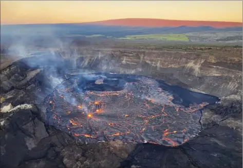  ?? U.S. Geological Survey photo via AP ?? This photo shows the inside of the summit crater of Kilauea on Friday. Kilauea has begun erupting less than one month after its larger neighbor Mauna Loa stopped releasing lava.