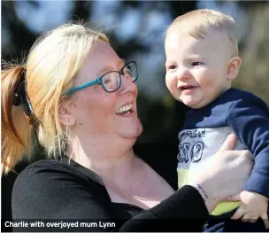  ??  ?? Charlie with overjoyed mum Lynn