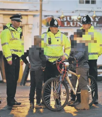 ??  ?? Police talk to youngsters who arranged the boozing gathering in Houghton