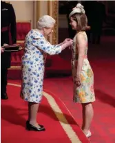  ??  ?? Majestic moment: Dame Darcey Bussell is honoured by the Queen, 4th May 2018