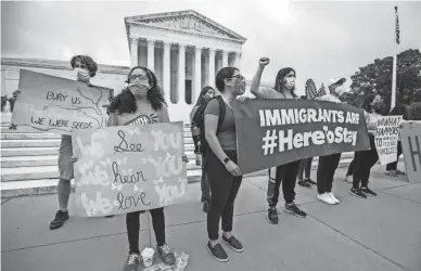  ?? MANUEL BALCE CENETA/AP FILE ?? Deferred Action for Childhood Arrivals students celebrate June 18 in Washington after the Supreme Court rejected then-President Donald Trump’s bid to end legal protection­s for young immigrants.