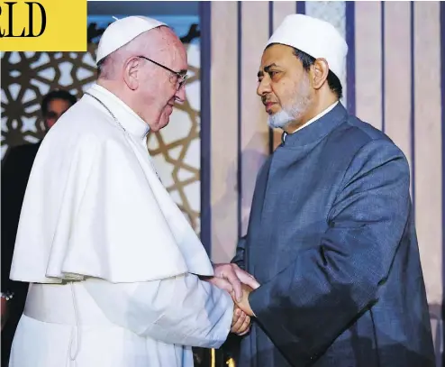  ?? AFP / AL-AZHAR MEDIA CENTRE ?? Pope Francis shakes hands with Sheikh Ahmed al-Tayeb, Grand Imam of Al-Azhar university, during a visit Friday in Cairo, where he rejected “every form of violence, vengeance and hatred carried out in the name of religion.”