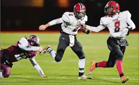  ?? SEAN D. ELLIOT/THE DAY ?? Fitch’s Tyler Nelli (2) follows the lead blocking of Hamear Stephens (8) during a Nov. 10 win over East Lyme. Nelli, Stephens and the unbeaten Falcons host Masuk tonight in the quarterfin­als of the Class L state football playoffs at 6:30 p.m.