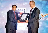  ??  ?? Seen here Managing Director of Vetedy Patrick Duemer handing over the certificat­e of dealership to Managing Director of Creation Master Builders Rohan Visidagama. Pic By Varuna Wanniarach­chi