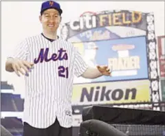  ?? ANDREW SAVULICH/DAILY NEWS ?? Todd Frazier smiles as he dons his new jersey at Citi Field, but he can’t be happy with free-agent market.