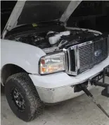  ??  ?? It was break-in time for Zach Green and his ’01 F-250 puller. After being furnished with a brand-new engine complete with Manley Performanc­e rods and de-lipped pistons, Green was looking forward to seeing how far his new powerplant could carry him in the dirt. When the rain canceled his original plans, however, he did the next best thing and joined in on the fun on the dyno. His fuel and oil setup consists of 300/400 injectors and a Gen3 over a 17-degree stocker, while a Forced Inductions Gangster 76mm S400SXR force-feeds boost into the heads. With trouble getting the big dual-rear-wheel Super Duty loaded on the rollers, Green’s Ford would end up with a boost-limited 617 hp.