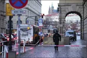  ?? (AP/Petr David Josek) ?? A policeman guards the area outside of Charles University in Prague on Friday.