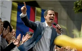  ?? AP ?? Juan Guaido, president of the Venezuelan National Assembly, tells a street rally in Caracas that with the nation’s backing, he is ready to take on Nicolas Maduro’s presidenti­al powers and call new elections.