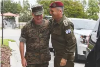  ?? (IDF) ?? US CENTRAL Command Gen. Kenneth McKenzie (left) embraces IDF Chief of Staff Lt.-Gen. Aviv Kohavi during the latter’s visit yesterday in Tampa Bay, Florida.