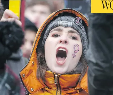  ?? DANIEL LEAL-OLIVAS/AFP/GETTY IMAGES ?? A protester takes part in the Women’s March in London on Sunday as part of a global day of protests, a year to the day since Donald Trump took office as U.S. president. Thousands rallied in European, Australian and U.S. cities, a day after similar...