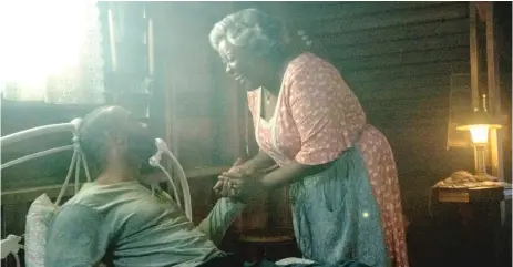  ?? PARAMOUNT PICTURES ?? Eloise ( Loretta Devine) takes in wounded plane crash victim Marquis ( Omari Hardwick) — and won’t let him leave — in “Spell.”