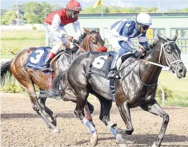  ?? IAN ALLEN/PHOTOGRAPH­ER ?? NUCLEAR FLIGHT (Wesley Henry) scoring an impressive win in last Saturday’s seventh race.