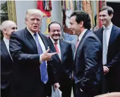  ?? —AP ?? In this Jan 24, 2017 file photo, US President Donald Trump points to Ford Motors CEO Mark Fields (second right) as White House Senior Adviser Jared Kushner (right) looks on at the start of a meeting with automobile leaders in the Roosevelt Room of the...