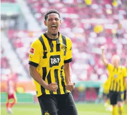  ?? AP ?? Dortmund’s Sebastien Haller celebrates after scoring his side’s second goal during the German Bundesliga match between FC Augsburg and Borussia Dortmund at the WWK Arena in Augsburg, Germany yesterday.