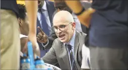  ?? Phelan M. Ebenhack / Associated Press ?? UConn coach Dan Hurley, center, talks to his players during a timeout in the second half against Central Florida in January.