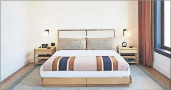  ?? [NICOLE FRANZEN VIA THE NEW YORK TIMES] ?? A guestroom at Shinola, a boutique hotel where everything from the sheets to the bedside clock are for sale