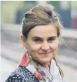  ??  ?? MP Jo Cox and (below) tributes left in Peterborou­gh