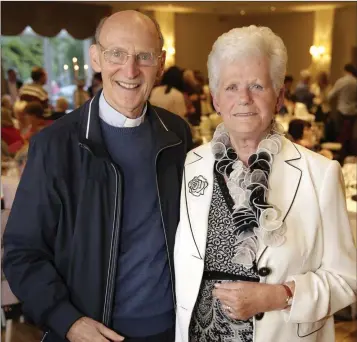  ??  ?? Fr John Wall pictured at his retirement party at the Summerhill Hotel Enniskerry, with sacristan Sadie O’Connell.