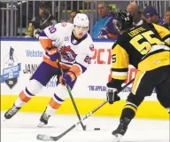  ?? Christian Abraham / Hearst Connecticu­t Media ?? The Sound Tigers’ Kieffer Bellows, left, drives the puck as the WB/Scranton Penguins’ Jon Lizotte defends in October.