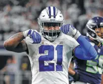  ?? Ron Jenkins / Associated Press ?? Cowboys running back Ezekiel Elliott celebrates Dallas’ wild-card victory over the Seahawks last Saturday. Elliott won his second rushing title in three years.