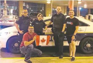  ??  ?? Eddie Fernandez, 34, and his husband, Tyler Thom, 32, took photos with Canadian border agents who welcomed them at the Windsor border entry when the couple moved to Canada in July 2018.