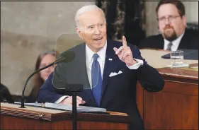  ?? SUSAN WALSH / AP ?? President Joe Biden delivers the State of the Union address Tuesday to a joint session of Congress at the U.S. Capitol. With at least a dozen calls for bipartisan­ship, which bracketed two direct veto threats — one against any abortion ban, the other against efforts to repeal last year’s Inf lation Reduction Act — Biden sought to present himself as the mature adult keeping watch over an unruly Congress.