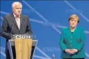  ?? AP FILE ?? Coalition dharma, German style: Merkel and Horst Seehofer