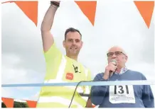  ??  ?? Carriganim­a organiser Jimmy Murphy and starter Liam Roche officiated at the 4 mile race. Picture John Tarrant