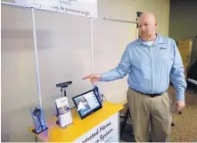  ?? JOSH BACHMAN/THE LAS CRUCES SUN NEWS/AP ?? Bryan Chasko of Electronic Caregiver explains the company’s virtual assistant that can measure and track a person’s medical condition.