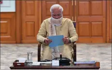  ?? IANS ?? Prime Minister Narendra Modi holds a review meeting to mitigate the spread of coronaviru­s, in New Delhi on 1 May 2020.
IMPROVED HEALTH INFRASTRUC­TURE TO DEAL WITH RISING CASES