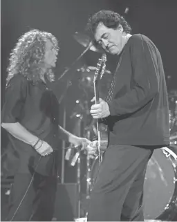  ?? E.J. FLYNN/AP ?? Led Zeppelin’s Jimmy Page and Robert Plant perform, Sept. 18, 1998, at the Irvine Meadows Ampitheatr­e in Irvine, California.