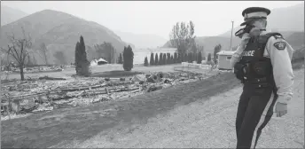  ?? CP PHOTO ?? The area of Boston Flats, B.C. is pictured July 11 after a wildfire ripped through the area earlier in the week. The new British Columbia government is extending the state of emergency for another two weeks as wildfires continue to sweep across the...