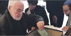  ??  ?? Bob Rubin checking out the contents of his sister’s suitcase