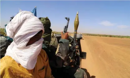  ?? Photograph: Souleymane Ag Anara/AFP/Getty ?? Fighters from a local armed groups patrol, aiming to lower the number of weapons in circulatio­n in and around the city of Menaka, situated between Mali, Niger and Burkina Faso.